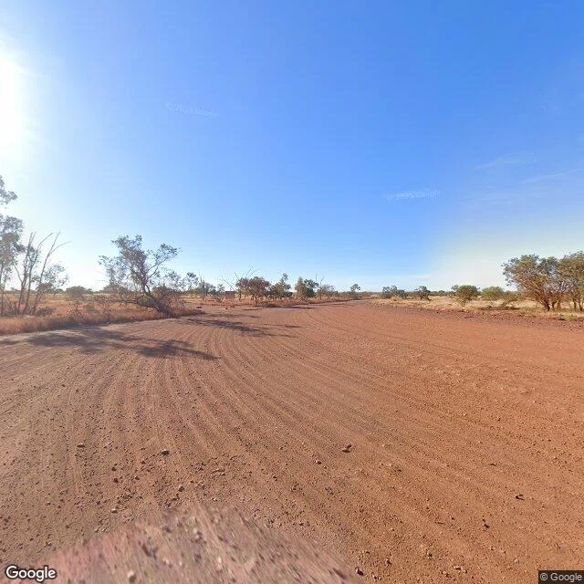 The town center, May 2025: red dirt, grader tracks, no buildings