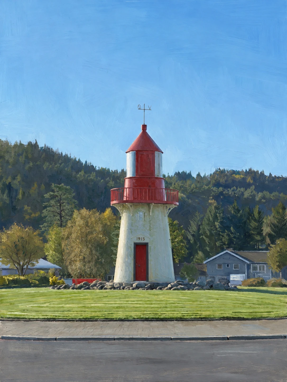 A replica of a lighthouse standing on a traffic island, painted pale with a red door