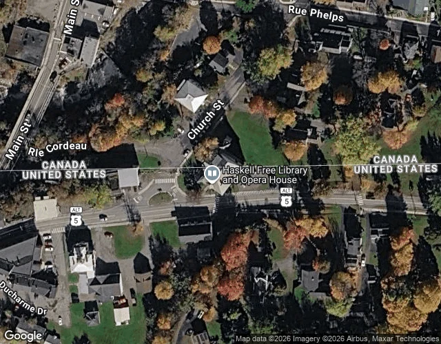 Overhead map of the Haskell Free Library and Opera House, with the US-Canada boundary line running straight through the property and street.