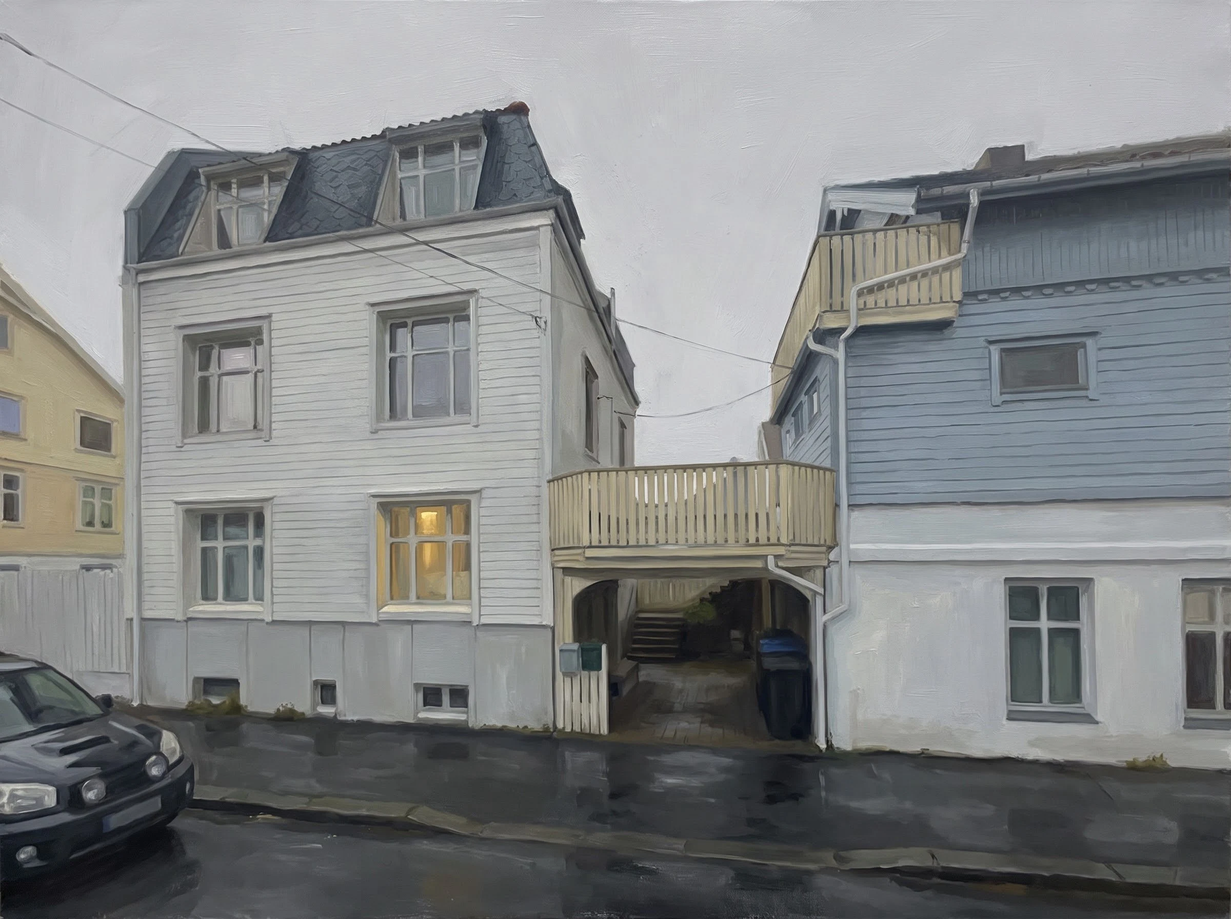 A rain-wet lane in Haugesund under flat grey light, one window lit