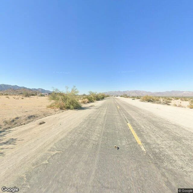 Sand drifting over the old road, Desert Center, California